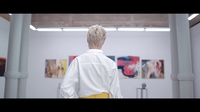 Video Reference: White, Photograph, Shoulder, Snapshot, Joint, Arm, Neck, Room, Photography, Art, Person, Indoor, Man, Standing, Kitchen, Front, Refrigerator, Food, Large, Holding, Wearing, Table, Woman, Screen, Young, Door, Mirror, Living, Red, Board, People, Shirt, Clothing