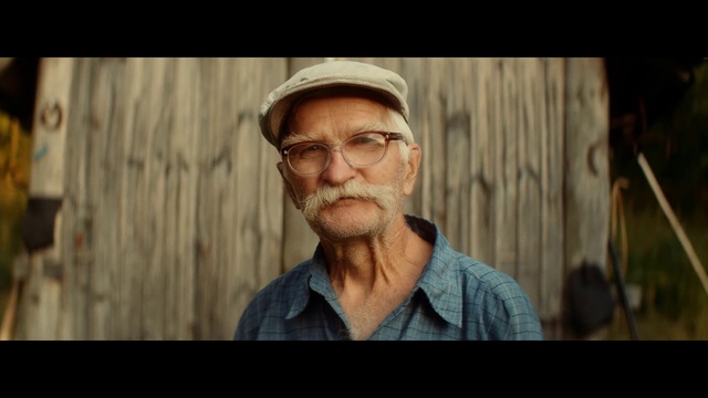 Video Reference: Hair, Moustache, Facial hair, Beard, Human, Headgear, Glasses, Smile, Portrait, Photo caption