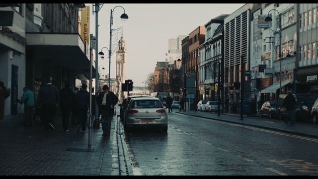 Video Reference: car, road, town, street, urban area, city, infrastructure, lane, downtown, neighbourhood