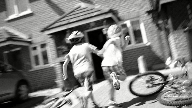 Video Reference: land vehicle, bicycle, photograph, vehicle, black and white, man, street, mode of transport, infrastructure, monochrome photography