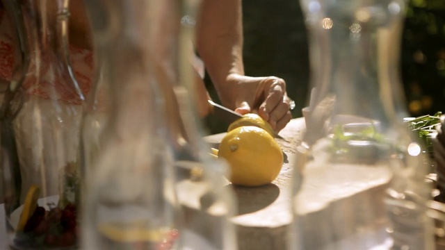 Video Reference: Yellow, Glass, Drink, Hand, Glass bottle, Fruit, Bottle