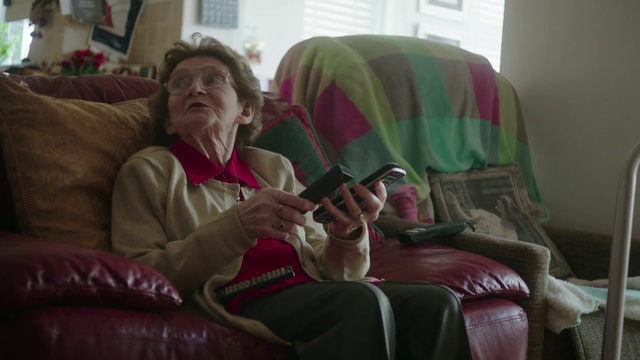 Video Reference: Sitting, Couch, Comfort, Mouth, Room, Grandparent, Furniture, Facial hair, Lap, Person