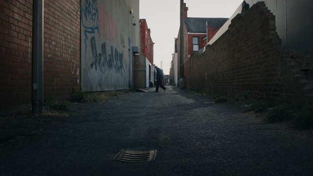 Video Reference: Alley, Road, Street, Lane, Town, Asphalt, Neighbourhood, Road surface, Wall, Infrastructure