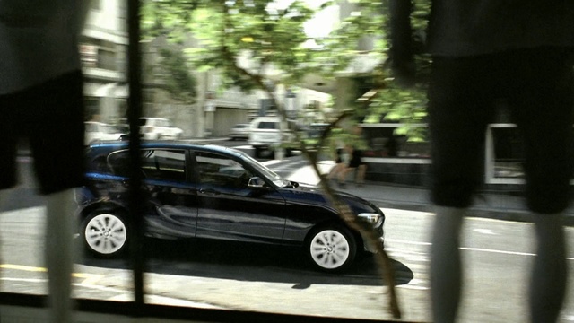 Video Reference: car, motor vehicle, land vehicle, vehicle, automotive design, mode of transport, road, personal luxury car, snapshot, family car, Person