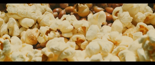 Video Reference: popcorn, kettle corn, snack, food, Person