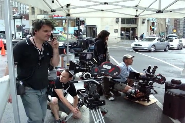 Video Reference: vehicle, product, car, television crew, cinematographer, filmmaking, Person
