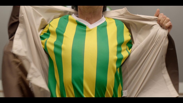 Video Reference: Green, Clothing, Yellow, T-shirt, Outerwear, Jersey, Sportswear, Sleeve