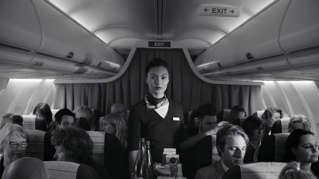 Video Reference: Air travel, Airline, Passenger, Aircraft cabin, Monochrome, Black-and-white, Photography, Airplane, Vehicle, Airliner, Person