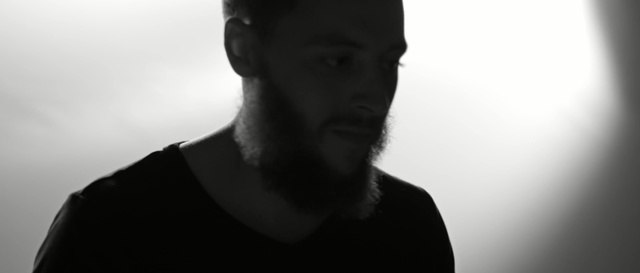 Video Reference: White, Face, Black, Hair, Facial hair, Photograph, Neck, Chin, Nose, Cheek