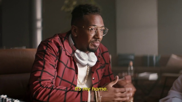 Video Reference: Adaptation, Person, Indoor, Table, Man, Sitting, Glasses, Woman, Looking, Holding, Wine, Cake, Using, Young, Food, Standing, Glass, Room, Laptop, Shirt, White, Living, Plate, People, Wall, Human face, Clothing, Human beard, Fashion accessory