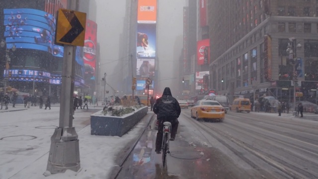 Video Reference: urban area, town, lane, mode of transport, pedestrian, snow, city, winter, downtown, street, Person