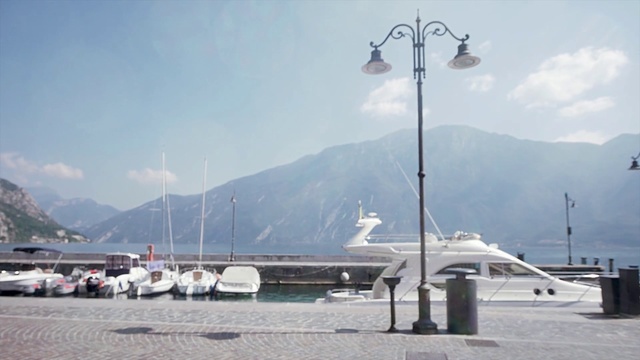 Video Reference: Street light, Lighting, Mountain range, Sky, Light fixture, Vehicle, Mountain, Marina, Wind, Tourism