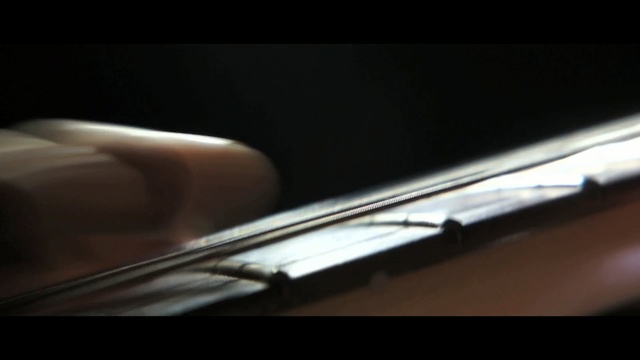 Video Reference: black, string instrument, mode of transport, close up, light, photography, automotive design, windshield, material, glass