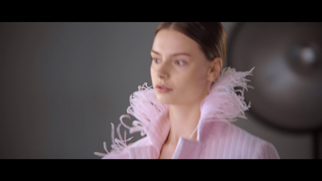 Video Reference: Face, Hair, Photograph, Facial expression, Lady, Skin, Nose, Pink, Portrait, Cheek, Person, Indoor, Clothing, Holding, Woman, Looking, Video, Television, Screen, Room, Monitor, Man, Hand, Remote, Dress, Girl, Sitting, Young, Table, Shirt, Living, Cake, White, Game, Standing, Wii, Laptop, Computer, Playing, Suit, Red, Wall, Human face, Screenshot, Wedding dress, Bride