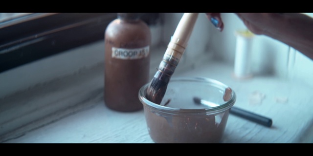 Video Reference: Brown, Finger, Hand, Nail, Material property, Tobacco products, Chocolate, Nail polish