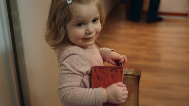 Video Reference: child, toddler, cheek, girl, infant, product, finger, play, Person