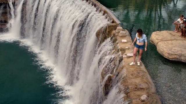 Video Reference: waterfall, body of water, water resources, water, water feature, watercourse, rapid, chute, river, tourist attraction, Person