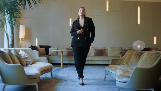 Video Reference: furniture, outerwear, suit, interior design, Person