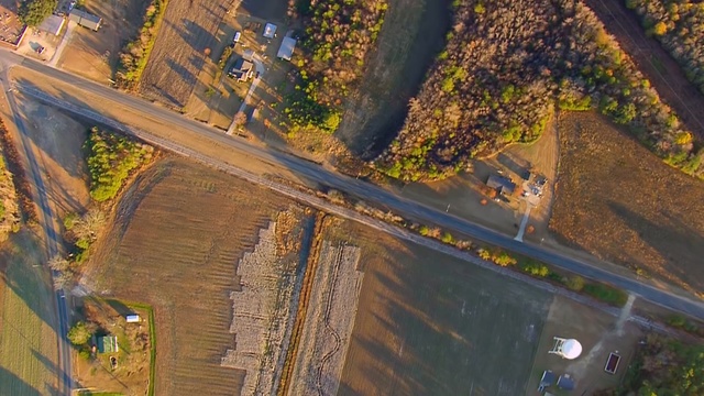 Video Reference: aerial photography, photography, bird's eye view, tree, suburb, plant, screenshot, landscape, road, sky