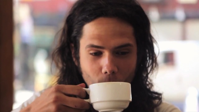 Video Reference: cup, container, coffee, tableware, drink, beverage, mug, ware, tea, hot, breakfast, espresso, saucer, morning, Person