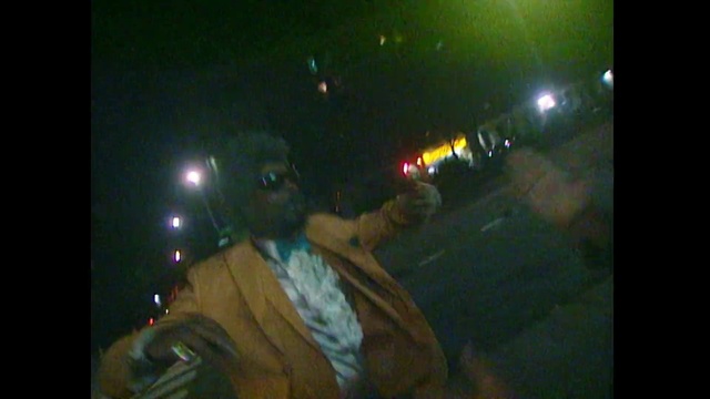 Video Reference: Black, Green, Light, Music, Darkness, Night, Lighting, Performance, Lens flare, Fun, Person, Sitting, Man, Dark, Lit, Wearing, Phone, Holding, Woman, Red, Laptop, Street, Table, Young, Room, Riding, Standing, Bus, Doing, Vehicle, Car, Text, Land vehicle