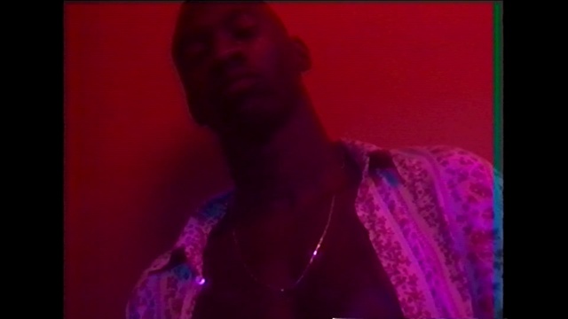 Video Reference: red, black, purple, pink, man, singing, stage, magenta, violet, performance, sad, serious, Person