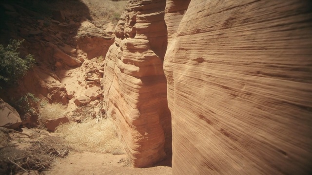 Video Reference: canyon, rock, formation, wadi, geology, landscape, soil, narrows, sand, sky, Person