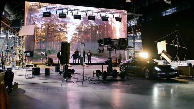 Video Reference: Luxury vehicle, Stage, Car, Vehicle, Auto show, Automotive design, Building, Architecture, Sound stage, Sports sedan