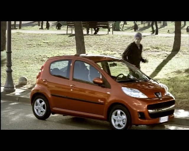 Video Reference: car, land vehicle, motor vehicle, vehicle, city car, citroën c1, automotive design, hatchback, subcompact car, bumper, Person