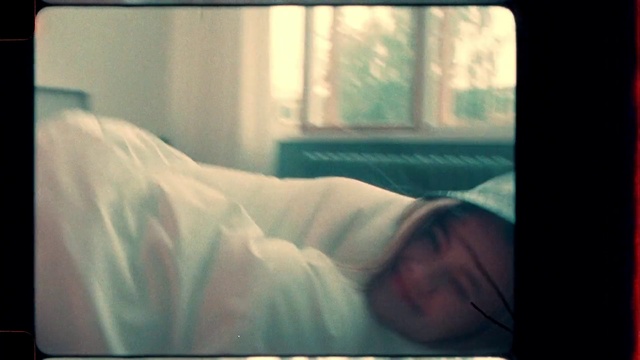 Video Reference: Eyebrow, Mouth, Comfort, Cloud, Window, Bed, Tints and shades, Linens, Human leg, Room