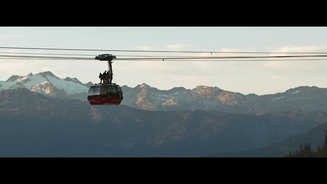 Video Reference: Cable car, Sky, Cable car, Vehicle, Mountain, Mountain range, Cloud, Helicopter