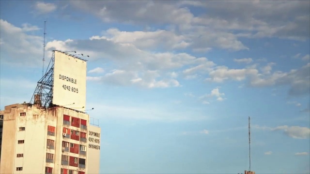 Video Reference: Sky, Cloud, Daytime, Cumulus, Metropolitan area, Horizon, Architecture, Font, Sea, Advertising