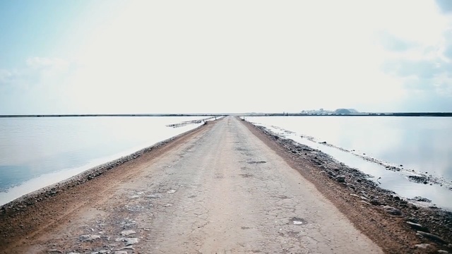 Video Reference: horizon, sea, sky, water resources, fixed link, water, road, calm, reflection, breakwater