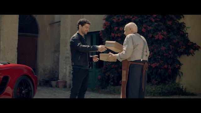 Video Reference: Photograph, Snapshot, Gentleman, Interaction, Fun, Photography, Screenshot, Automotive design, Scene, Conversation, Person, Man, Building, Standing, Holding, Playing, Front, Street, Living, Room, Young, Walking, Red, Woman, Video, People, Fire, Suitcase, Luggage, Game, Board, Riding, Remote, Clothing, Suit