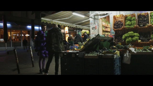 Video Reference: public space, market, stall, night, marketplace, street, city, bazaar, darkness, midnight, Person
