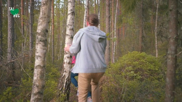 Video Reference: Forest, Woodland, Natural environment, Nature reserve, Tree, Wilderness, Walking, State park, Northern hardwood forest, Recreation, Outdoor, Grass, Person, Plant, Standing, Man, Wood, Wooded, Green, Young, Looking, Woman, Cross, Holding, Path, Country, Covered, Field, Park, Tall, Phone, White, Sign, Riding, Clothing, Hiking, Footwear, Trousers, Jacket