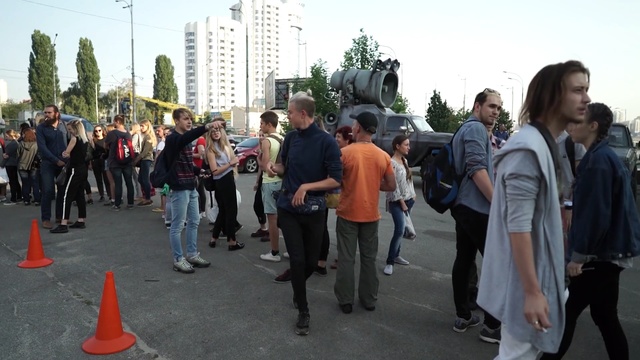 Video Reference: crowd, event, vehicle, protest, car, pedestrian, recreation, street, city, tree, Person