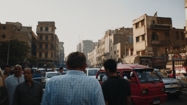 Video Reference: Mode of transport, Vehicle, Car, Town, Human settlement, City, Travel, Neighbourhood, Urban area, Traffic, Person