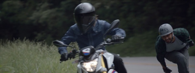 Video Reference: helmet, headgear, personal protective equipment, stunt performer, vehicle, extreme sport, adventure, tree, grass, stunt