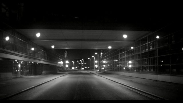 Video Reference: metropolitan area, black, night, lane, black and white, atmosphere, infrastructure, darkness, light, highway