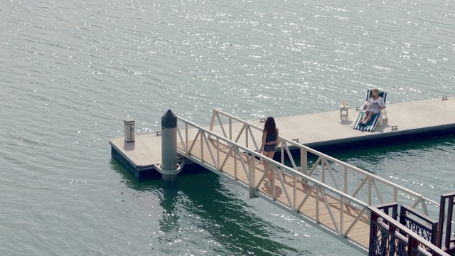 Video Reference: Water transportation, Pier, Boat, Ferry, Vehicle, Water, Dock, Watercraft, Nonbuilding structure, Channel