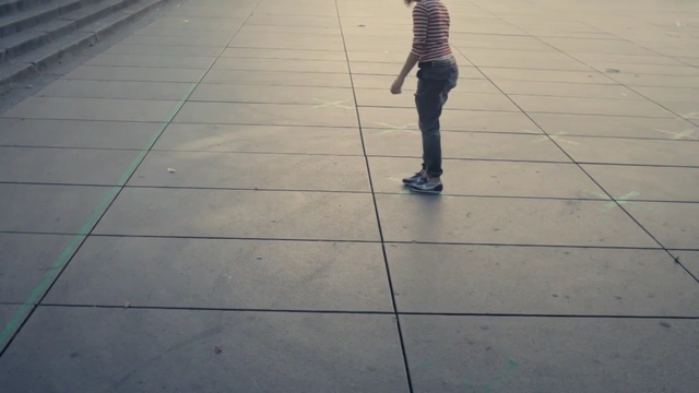 Video Reference: Floor, Standing, Line, Shadow, Leg, Road surface, Flooring, Tile, Sidewalk, Human leg