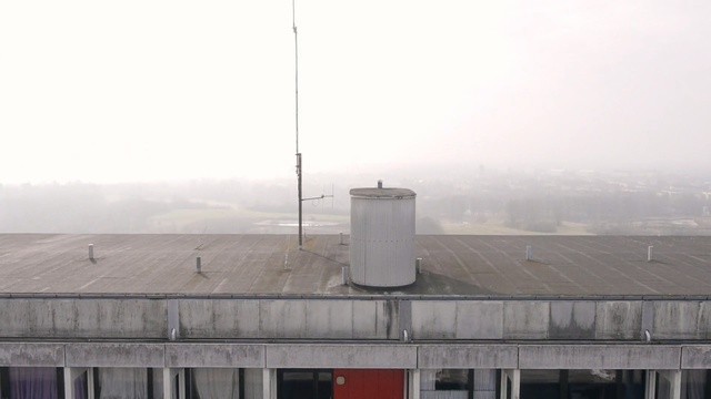 Video Reference: fog, haze, roof, building, sky