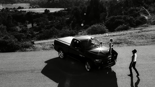 Video Reference: car, land vehicle, motor vehicle, black, vehicle, black and white, automotive design, photography, automotive exterior, wheel