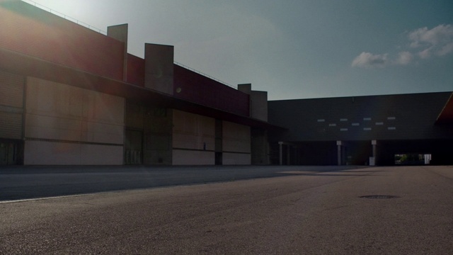 Video Reference: Sky, Architecture, Property, Light, Asphalt, Building, Design, Night, Material property, Commercial building