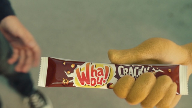 Video Reference: yellow, hand, finger, fun, junk food, material, snack, play, Person