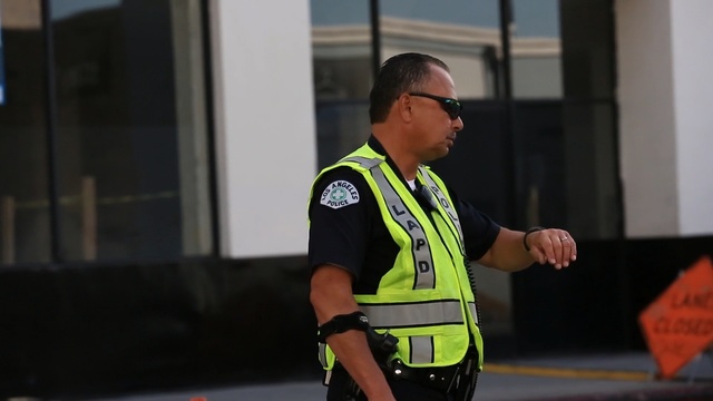 Video Reference: vehicle, official, car, police, police, race, recreation