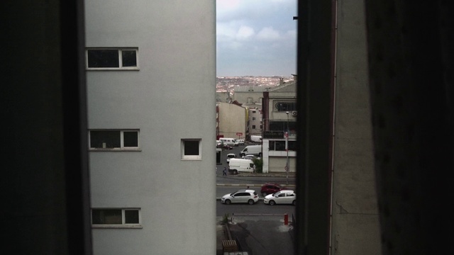 Video Reference: Urban area, Sky, Architecture, Room, Neighbourhood, Material property, Window, Building, Road, Door