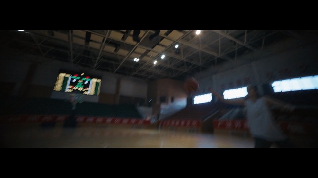 Video Reference: Light, Sport venue, Infrastructure, Darkness, Architecture, Arena, Photography, Night, Stadium, Indoor, Ceiling, Man, Standing, Woman, Room, Holding, Large, Train, Screen, People, Table, Pizza, Computer, Airplane, Red, Yellow, Station, Plane, Remote, Video, Luggage, Blurry, Playing, Group, Screenshot, Person