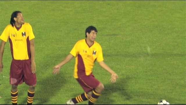 Video Reference: player, football player, yellow, sport venue, green, football, games, soccer player, sports, ball, Person